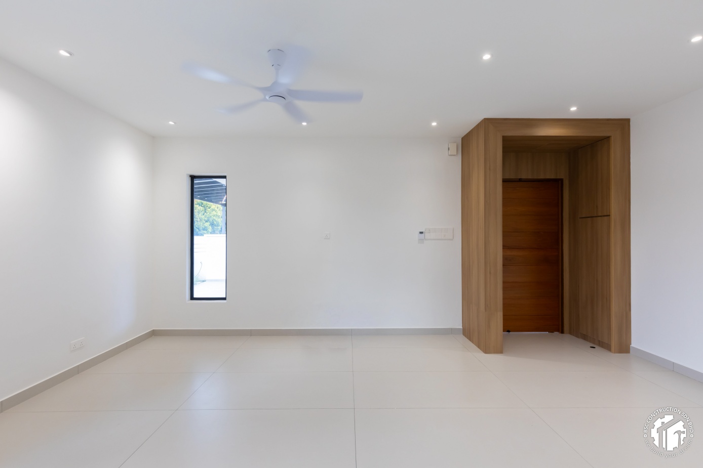 Hidden door integrated into wood panel feature wall