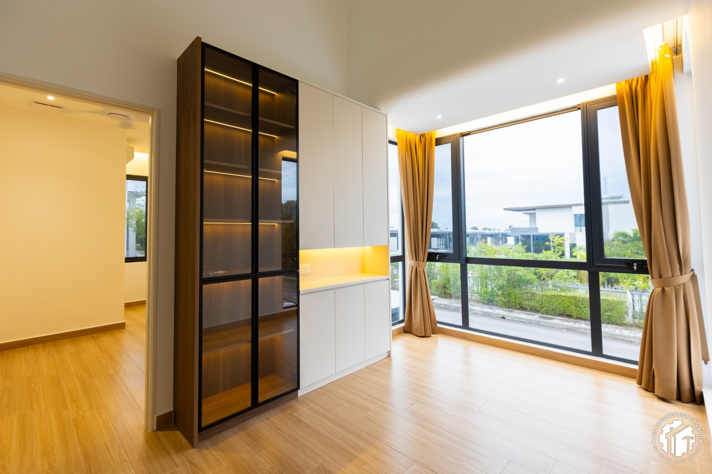 Modern built-in wardrobe with glass display section