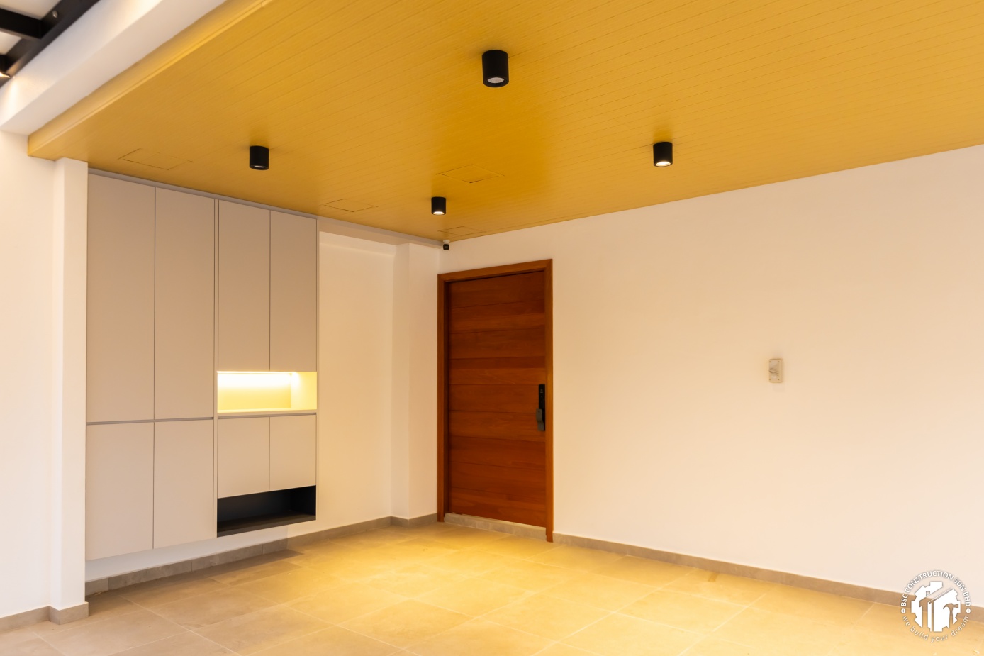 Modern foyer — wood ceiling and custom shoe cabinet