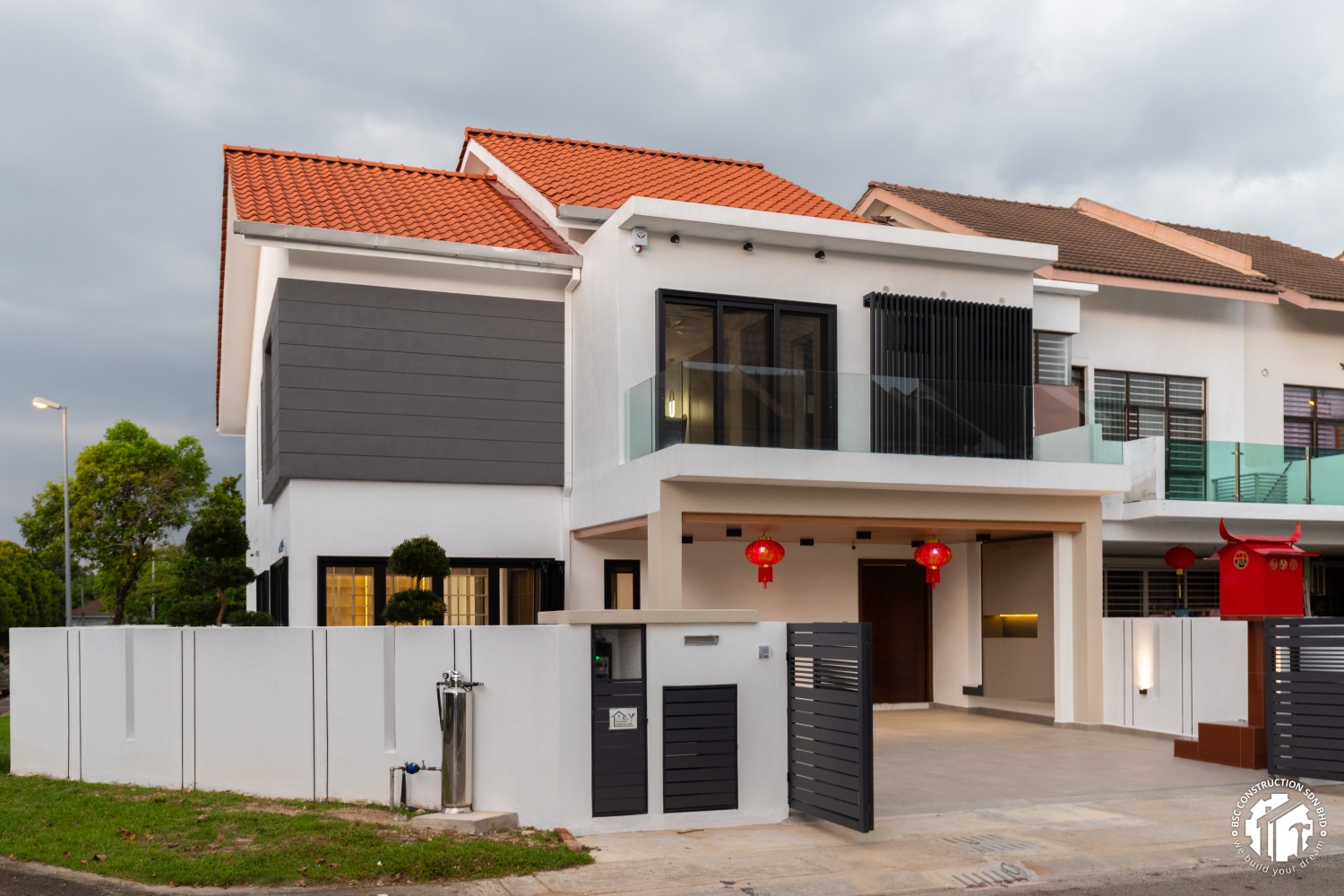 BSC Construction — whole house revamp with double storey extension, modern exterior evening view